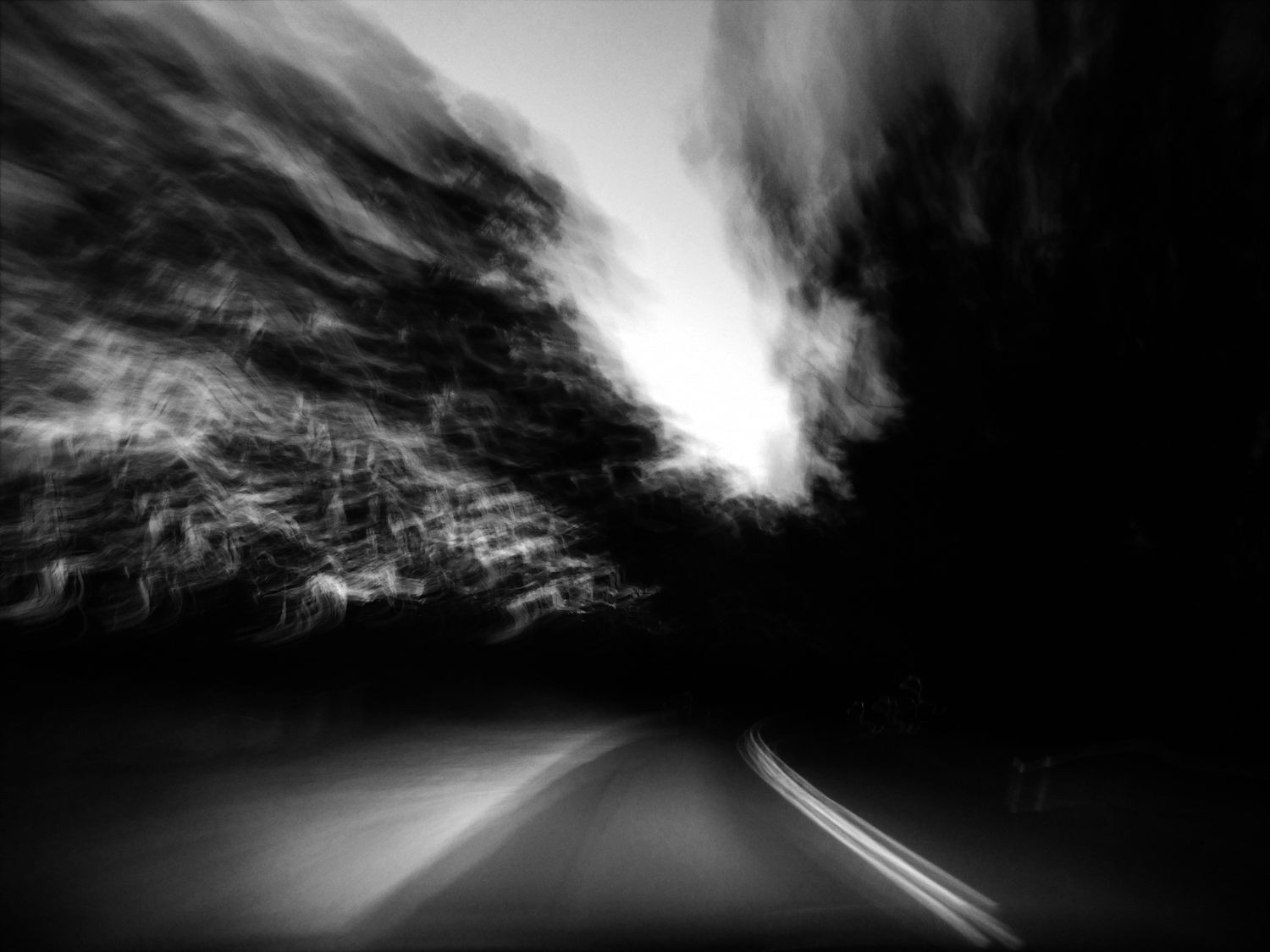 experimental phone photo of a blurry road